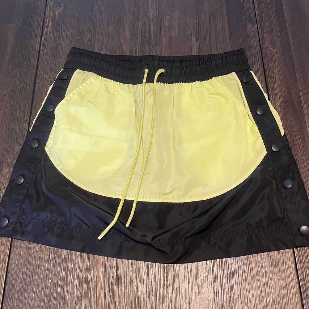 MTA sport tennis/golf snap up the side skirt. So cute and comfortable. Size S